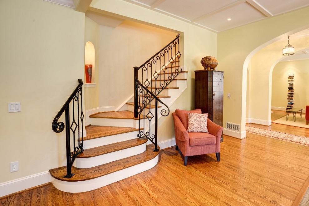 Example of a classic wooden l-shaped staircase design in Denver with painted risers