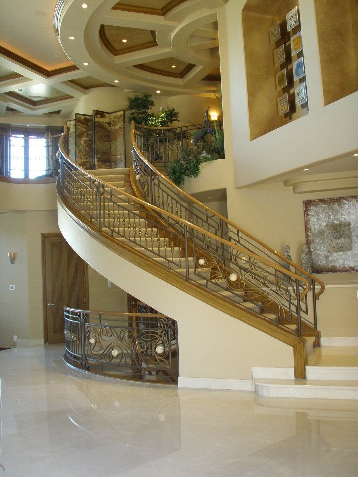 Inspiration for a mediterranean carpeted curved staircase remodel in Las Vegas with carpeted risers