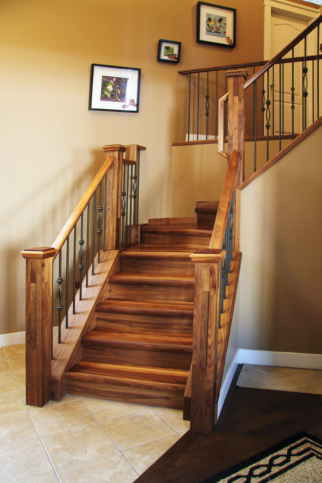 Large trendy wooden l-shaped staircase photo in Calgary with wooden risers