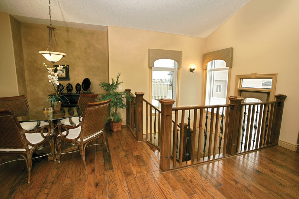 Photo of a large contemporary carpeted u-shaped staircase in Calgary with carpeted risers.