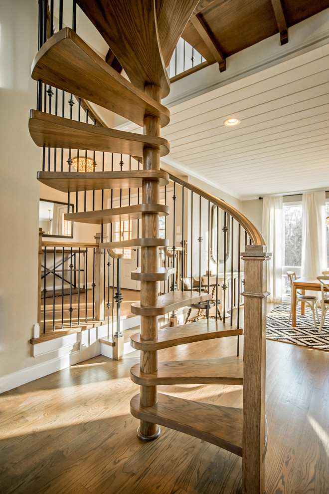 Small trendy wooden spiral open staircase photo in Charlotte
