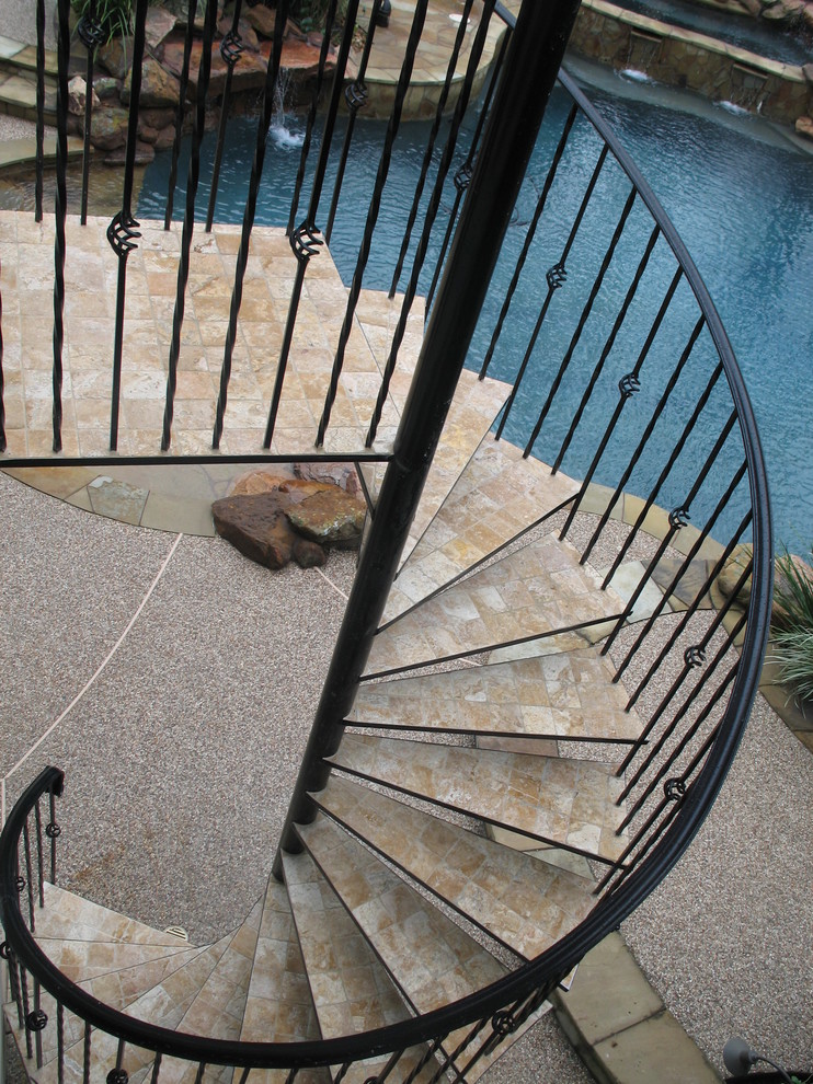 Inspiration for a timeless tile spiral open staircase remodel in Houston