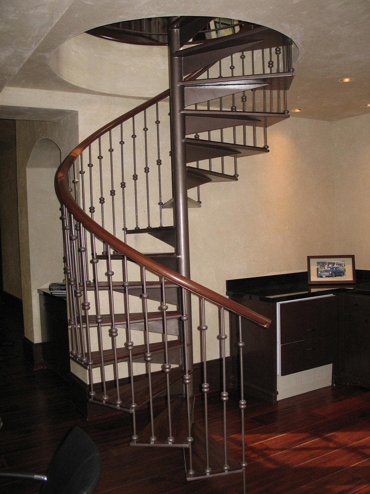 Staircase - mid-sized traditional wooden spiral open staircase idea in Houston