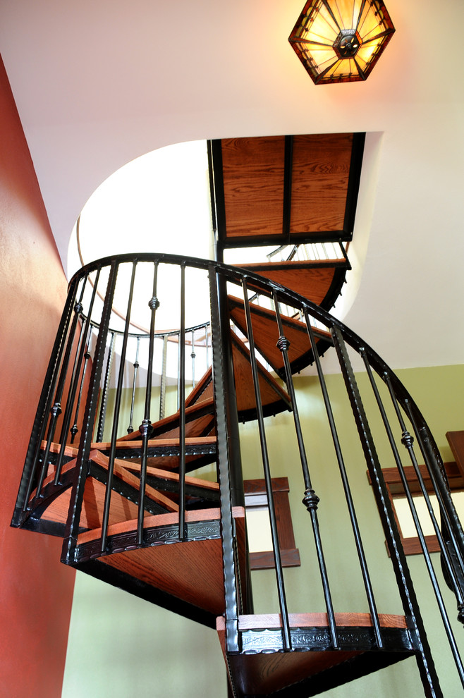Design ideas for a small classic wood spiral staircase in Other with metal risers.