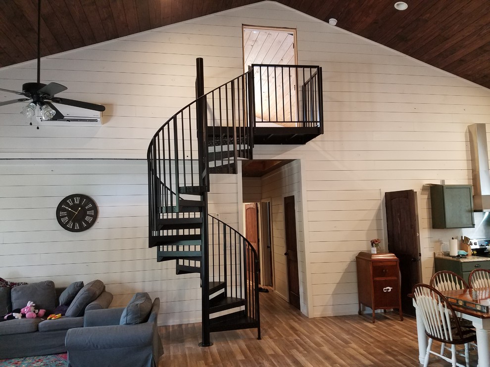 Medium sized rural metal spiral metal railing staircase in Wilmington with open risers.