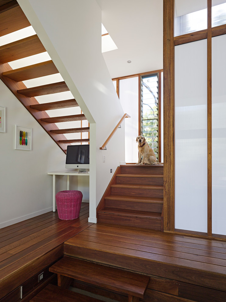 Inspiration for a contemporary wood u-shaped staircase in Sunshine Coast with open risers.