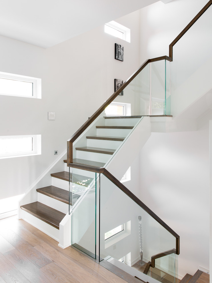 Staircase - mid-sized wooden u-shaped staircase idea in Ottawa with painted risers