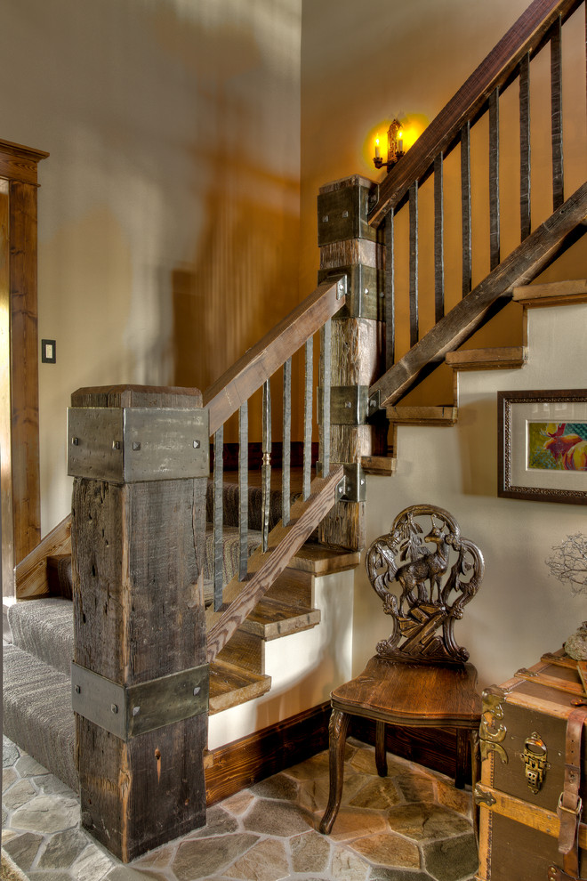 Staircase - rustic wooden l-shaped staircase idea in Minneapolis with wooden risers
