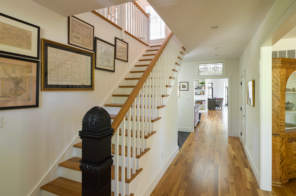 This is an example of a rural wood straight wood railing staircase in Philadelphia with painted wood risers.
