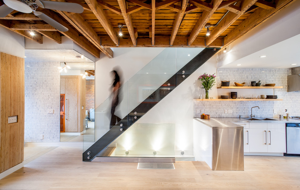Staircase - industrial glass railing staircase idea in Toronto