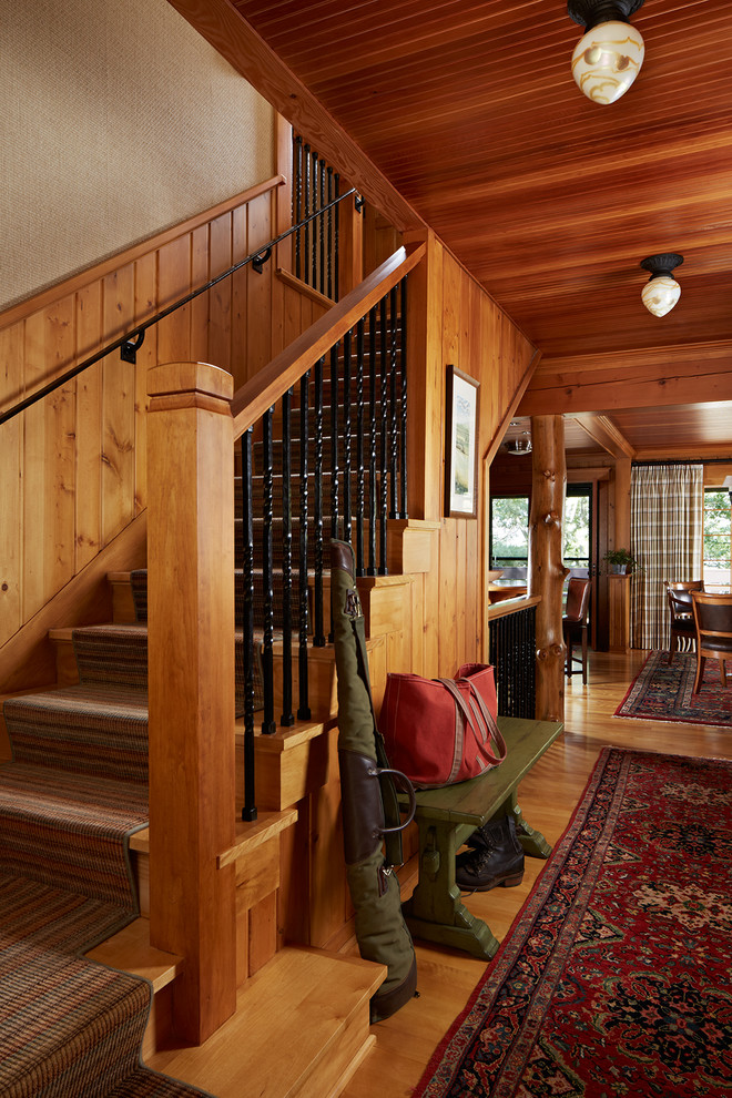 Mountain style wooden l-shaped staircase photo in Minneapolis with wooden risers