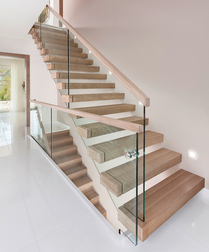 Inspiration pour un escalier flottant minimaliste avec des marches en bois.