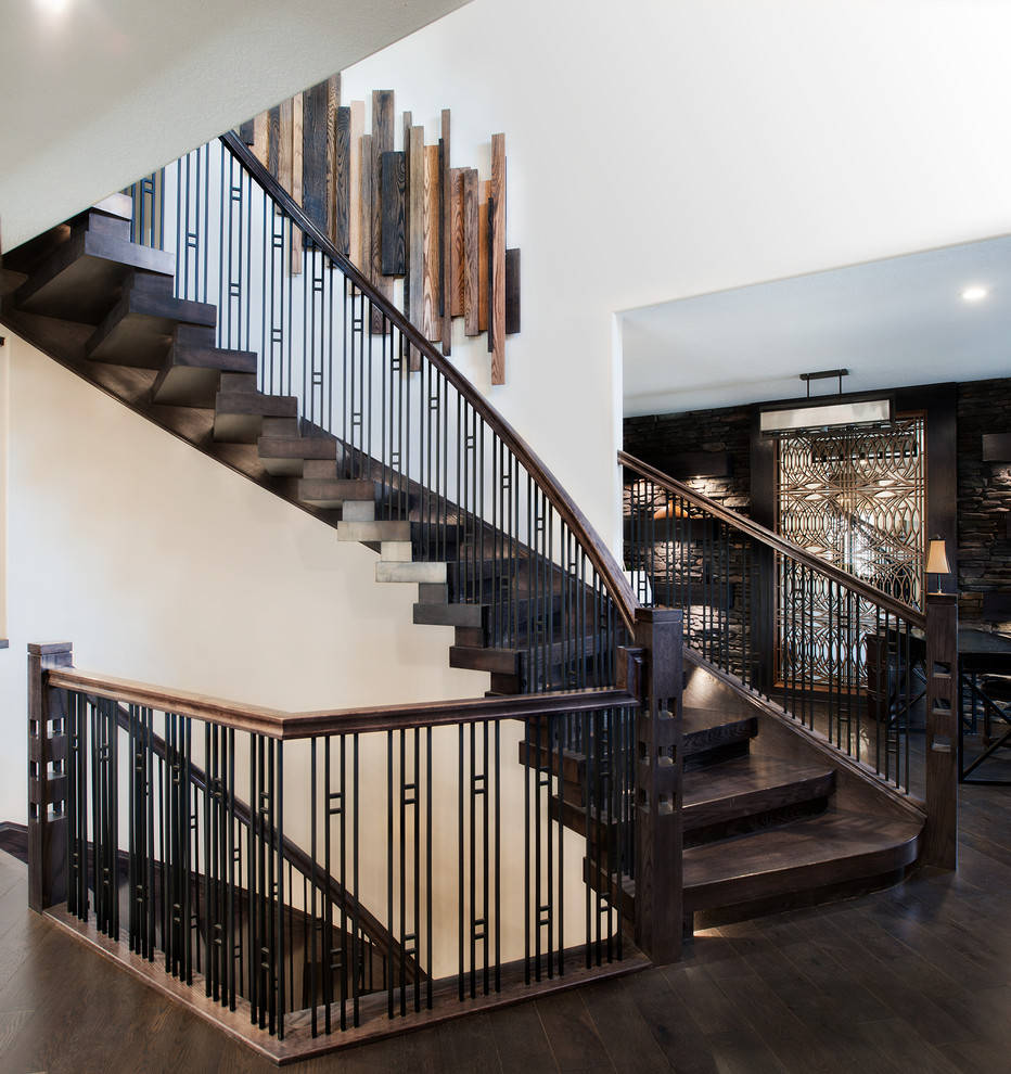 Staircase - contemporary wooden curved staircase idea in Edmonton with wooden risers