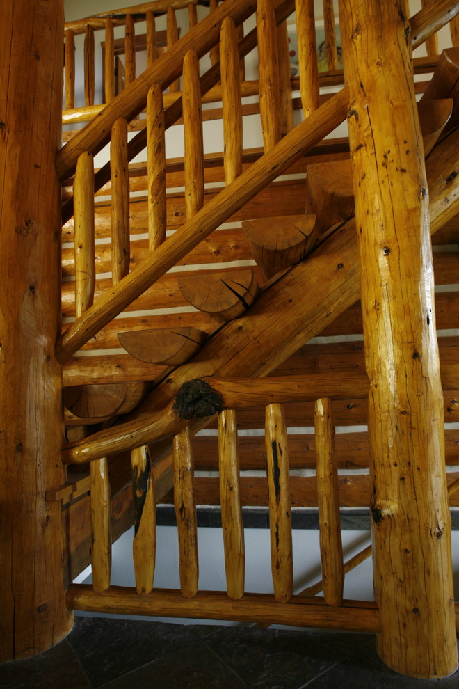 Mid-sized mountain style wooden straight staircase photo in Denver with wooden risers