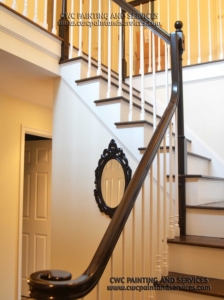 Staircase - mid-sized traditional u-shaped wood railing staircase idea in Boston with wooden risers