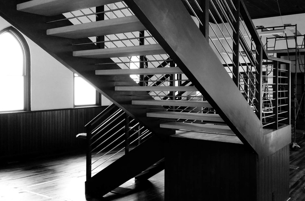 Idées déco pour un escalier sans contremarche moderne en L avec des marches en bois.