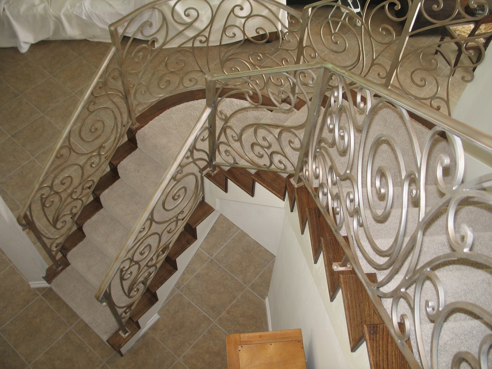Inspiration for a mid-sized craftsman carpeted curved staircase remodel in Houston with carpeted risers