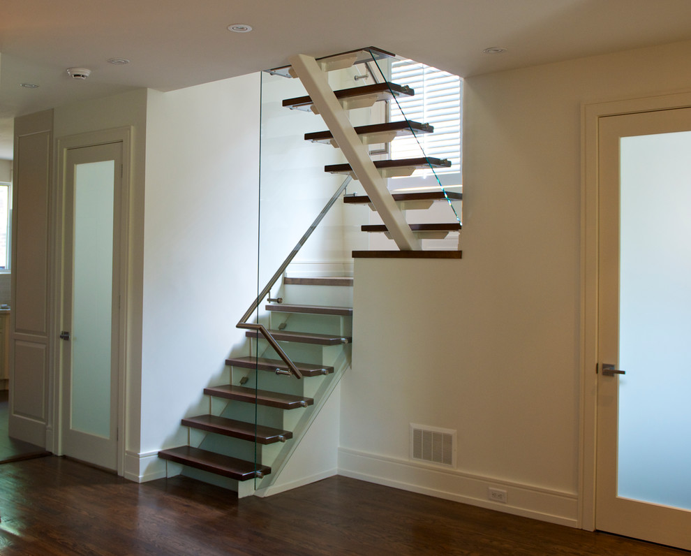 Inspiration for a small contemporary wooden u-shaped open staircase remodel in Toronto
