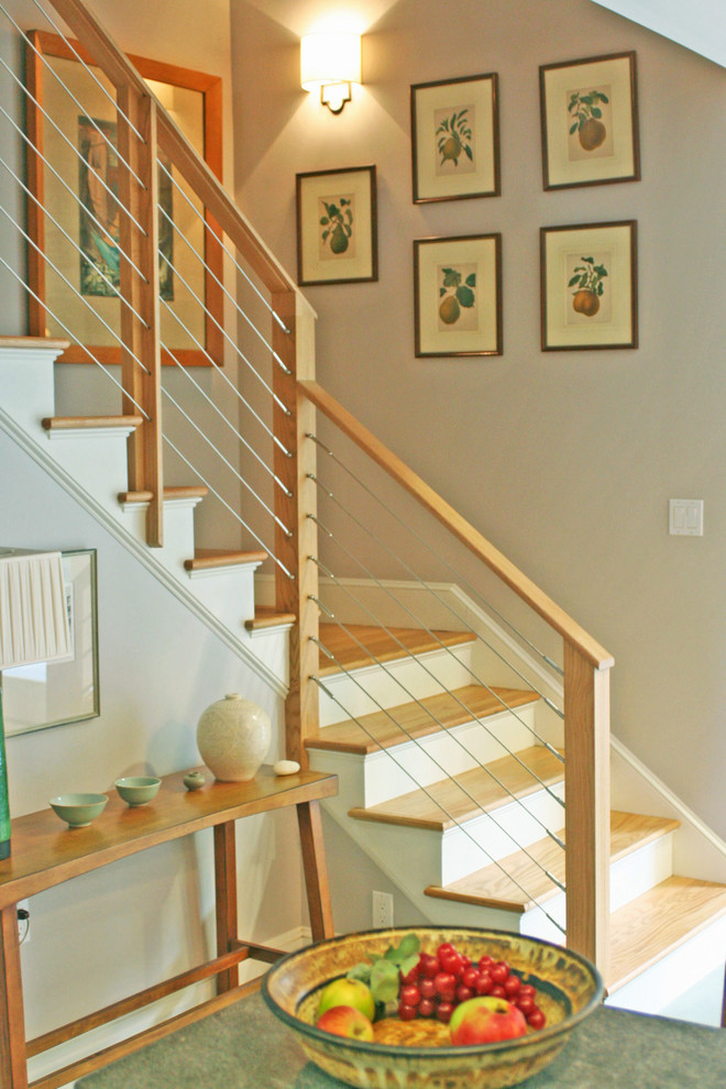 Medium sized modern wood l-shaped staircase in Providence with painted wood risers.
