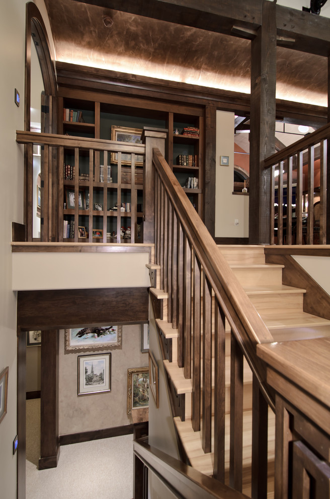 Exemple d'un escalier chic avec des marches en bois, des contremarches en bois et un garde-corps en bois.