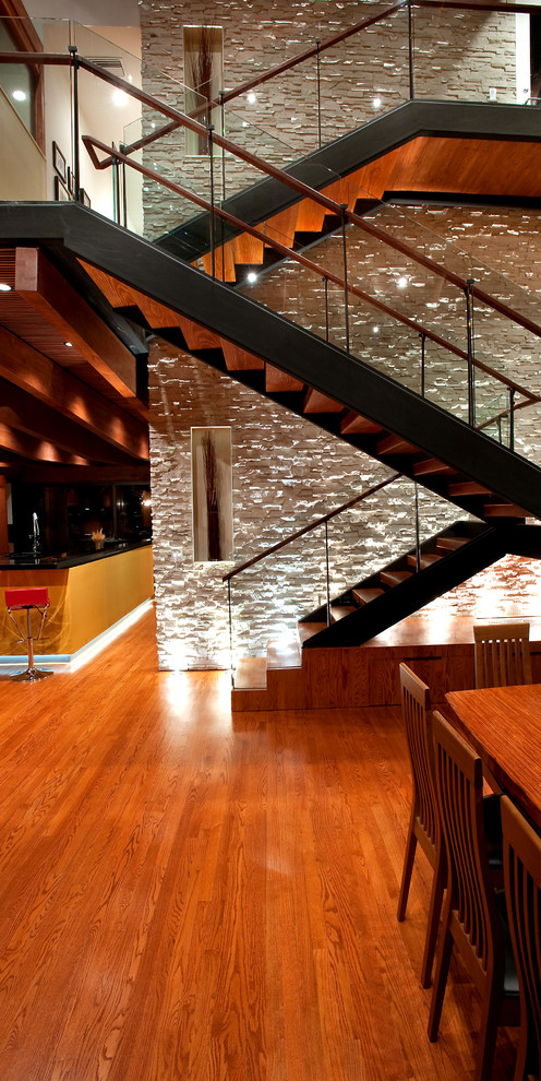 Design ideas for a medium sized retro wood l-shaped staircase in New York with open risers.