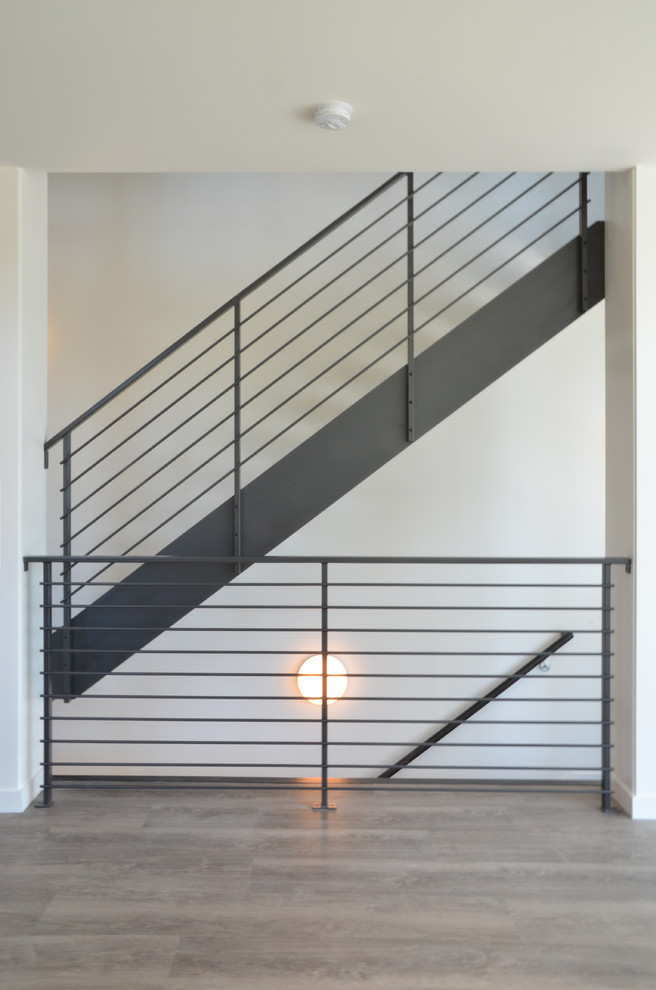 Example of a mid-sized trendy wooden u-shaped open and metal railing staircase design in Seattle
