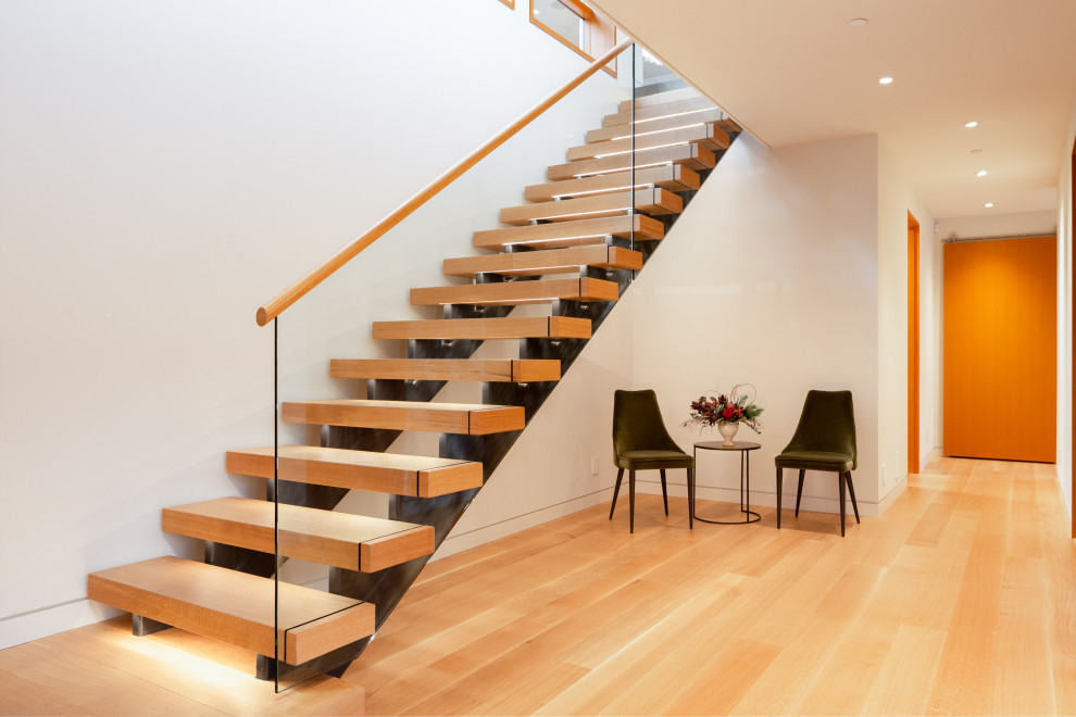 Photo of a medium sized contemporary staircase in Vancouver.