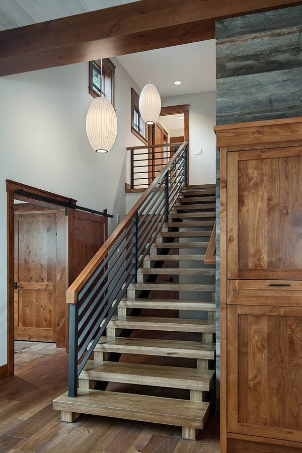 Staircase - mid-sized transitional wooden straight open and metal railing staircase idea in Other