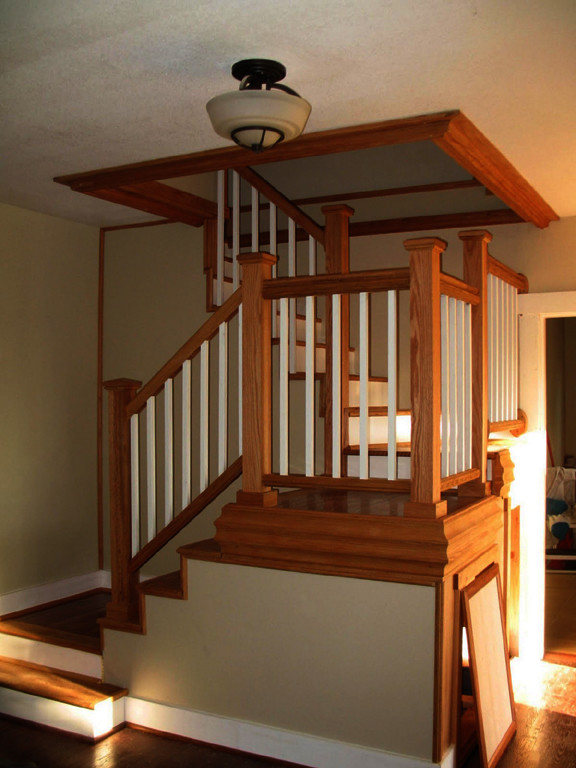 Mid-sized elegant wooden u-shaped staircase photo in Portland with wooden risers