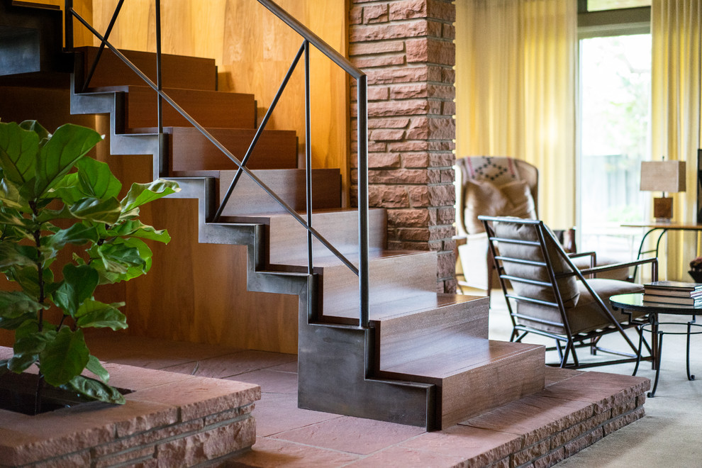 Design ideas for a contemporary wood staircase in Denver with wood risers and feature lighting.