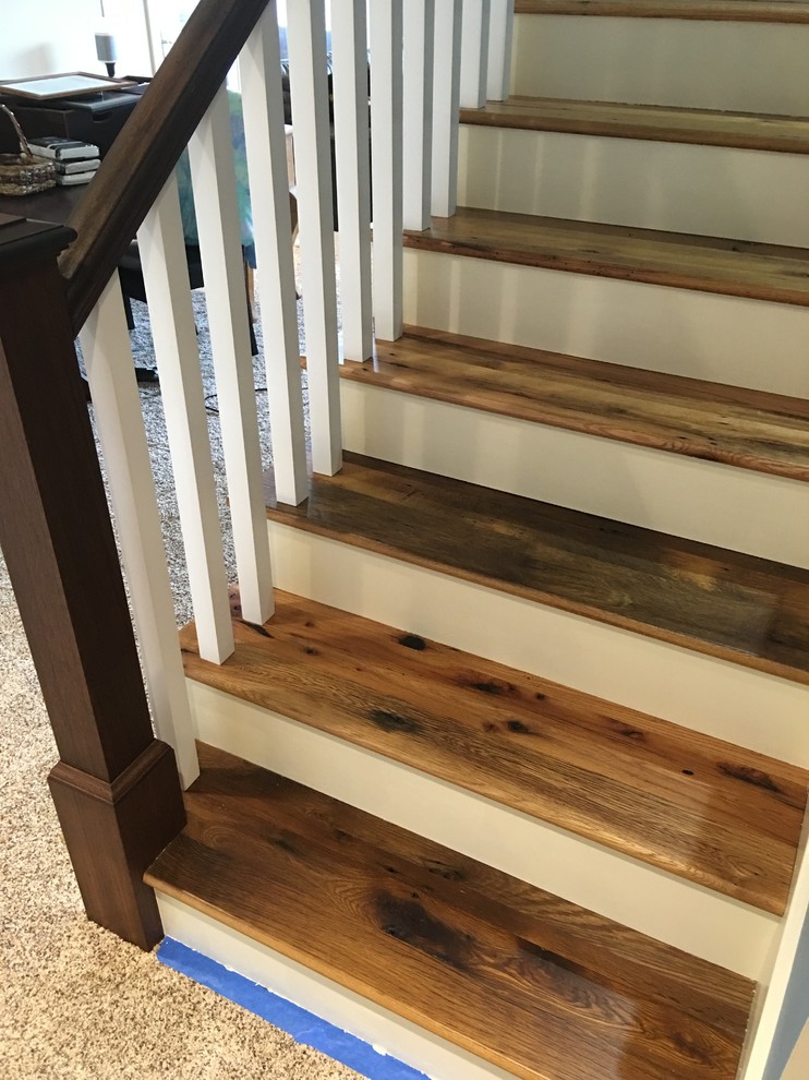 Design ideas for a large rustic wood l-shaped staircase in Other with painted wood risers.