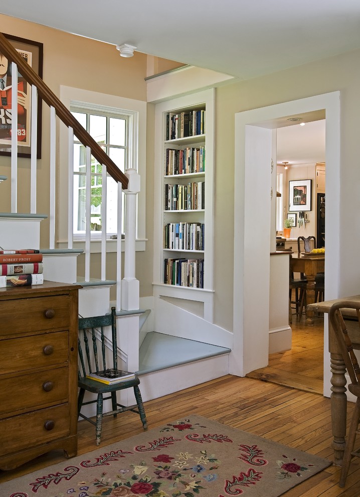 Example of a classic painted staircase design in Burlington with painted risers