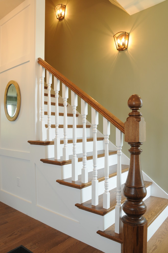 Mid-sized farmhouse wooden straight staircase photo in Other with wooden risers