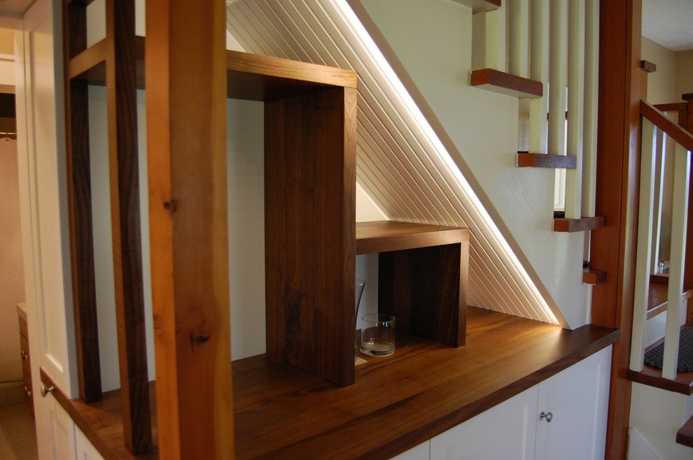 Inspiration for a small craftsman wooden l-shaped staircase remodel in Other with wooden risers