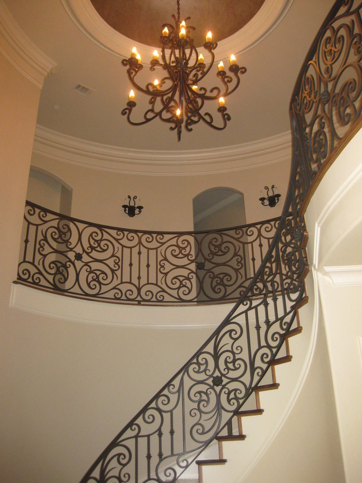 Inspiration for a large traditional wood curved staircase in Dallas with wood risers.