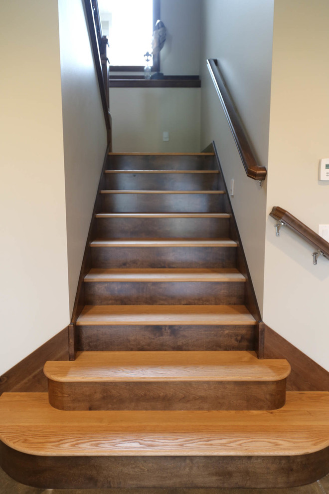 This is an example of a medium sized classic wood u-shaped mixed railing staircase in Other with wood risers.