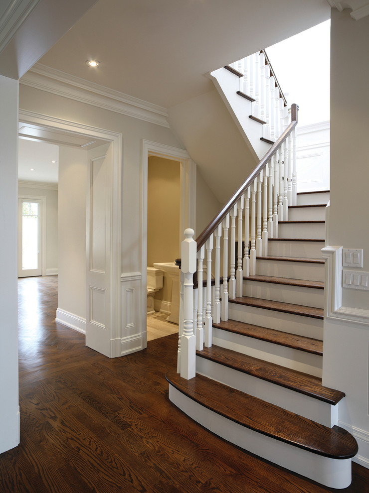 Inspiration for a mid-sized timeless wooden u-shaped wood railing staircase remodel in New York with painted risers