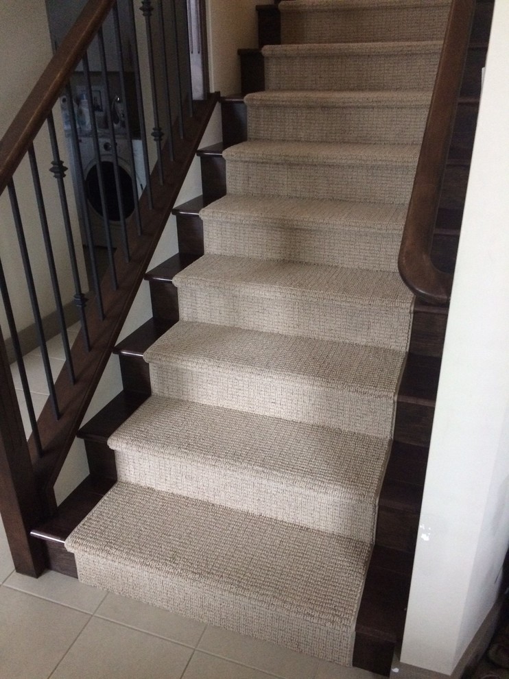 Medium sized classic carpeted straight staircase in Vancouver with carpeted risers.