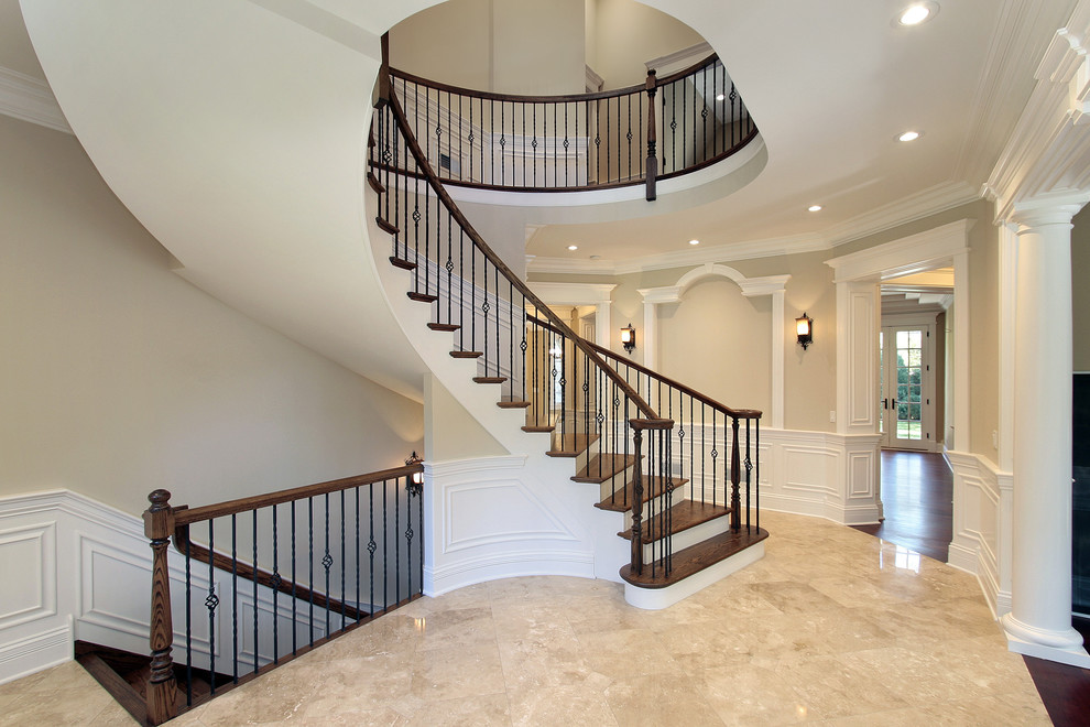 Design ideas for a large traditional wood curved staircase in New York with painted wood risers.