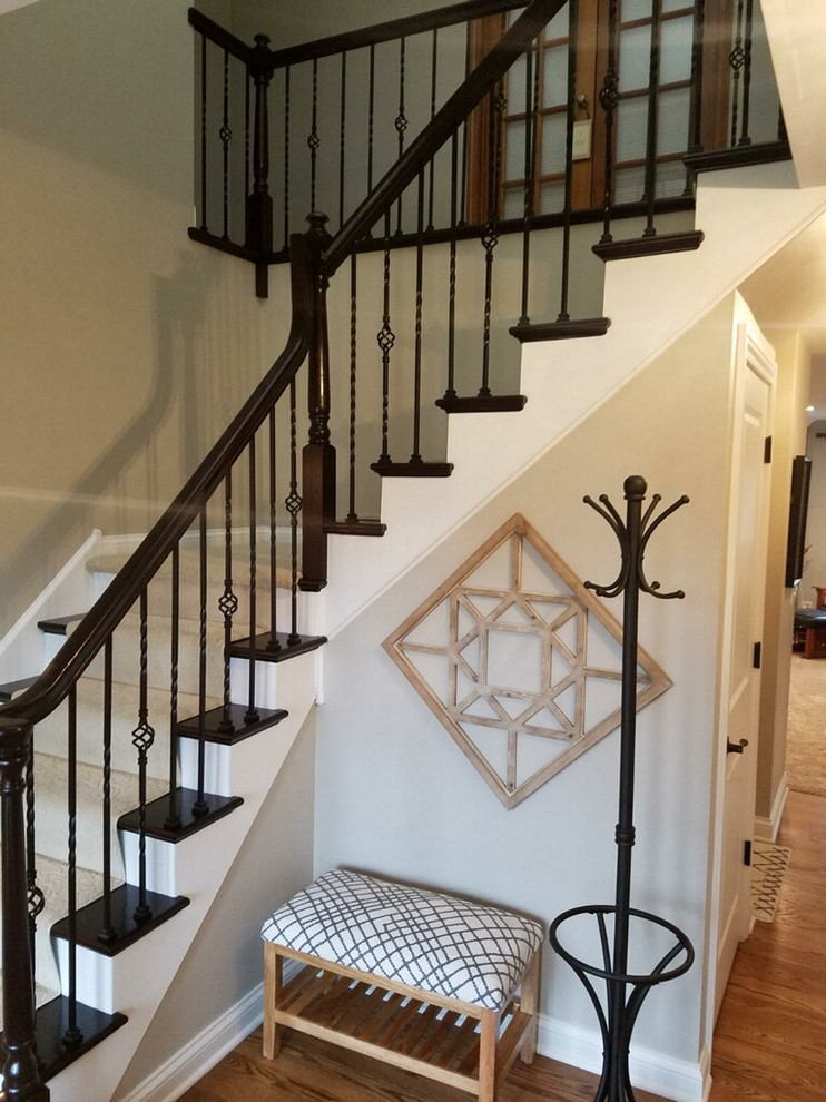 Photo of a medium sized traditional wood l-shaped mixed railing staircase in Chicago with painted wood risers.