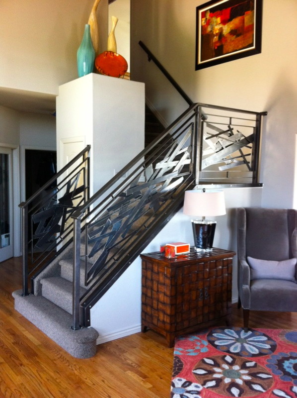 Inspiration for a mid-sized transitional carpeted l-shaped staircase remodel in Denver with carpeted risers