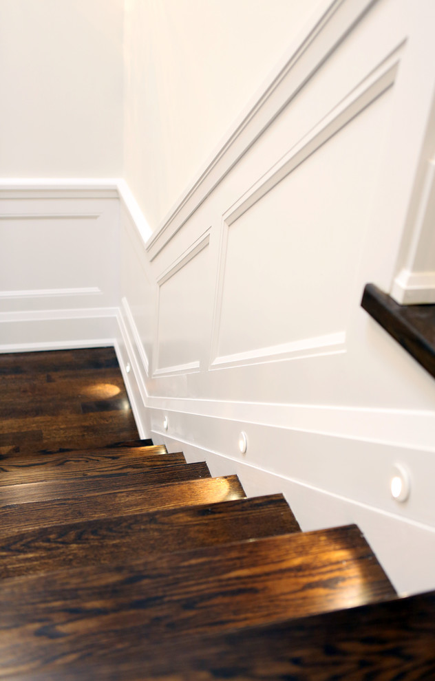 Design ideas for a medium sized traditional wood l-shaped staircase in Toronto with wood risers.