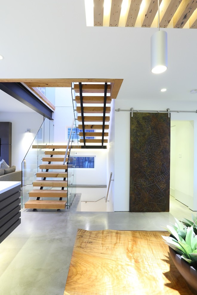 Medium sized contemporary wood floating staircase in Vancouver.