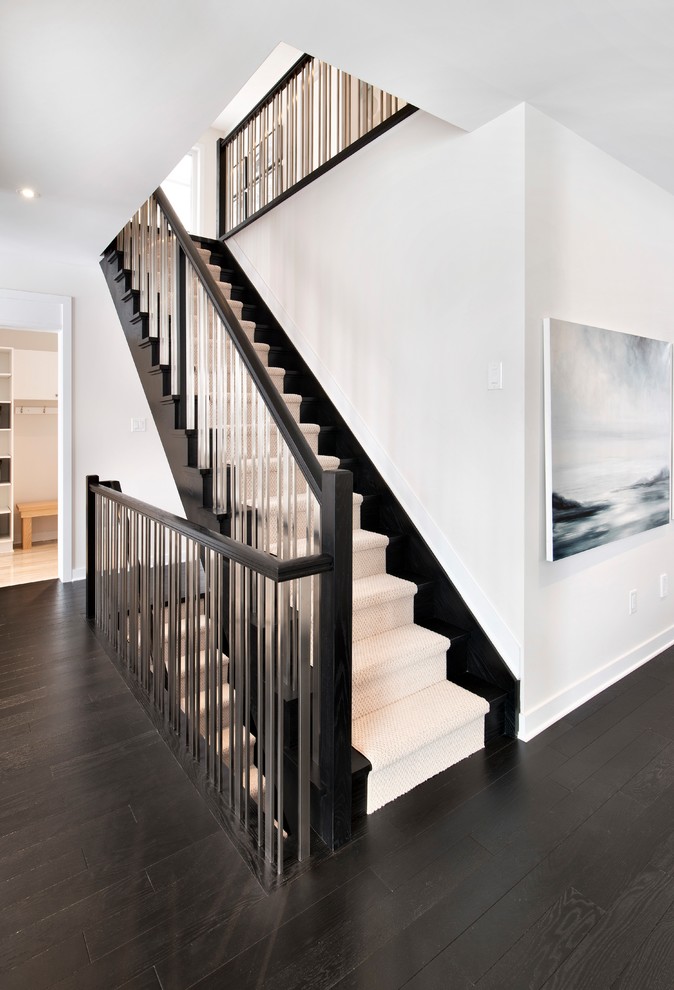 Inspiration for a medium sized traditional wood straight metal railing staircase in Ottawa with wood risers.