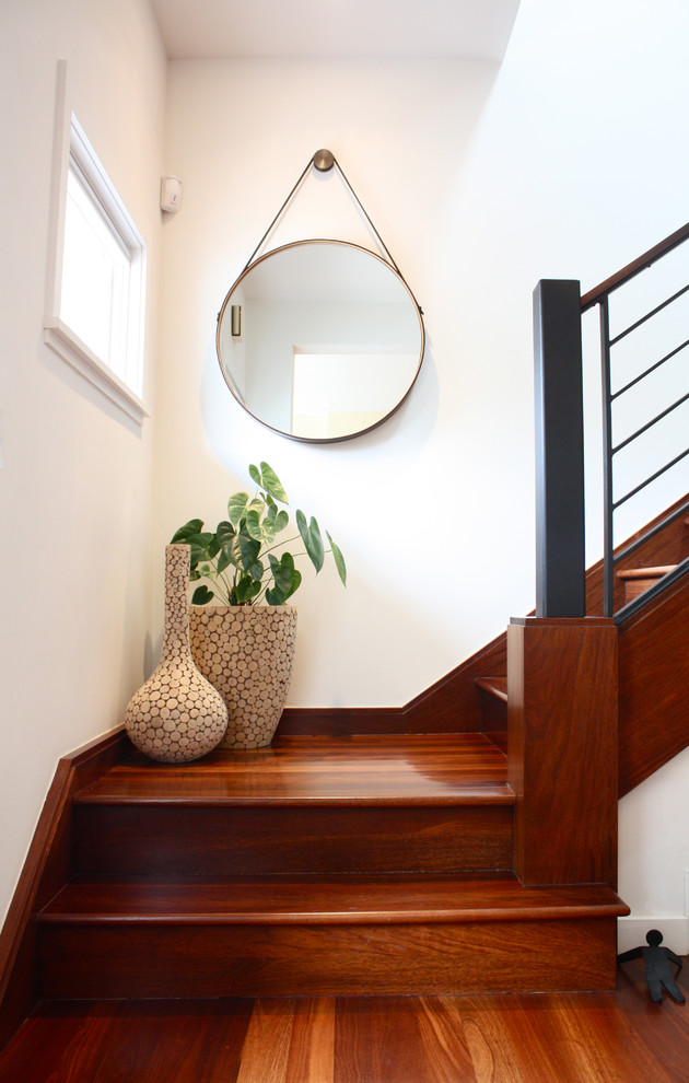 Photo of a contemporary wood staircase in San Francisco with wood risers.