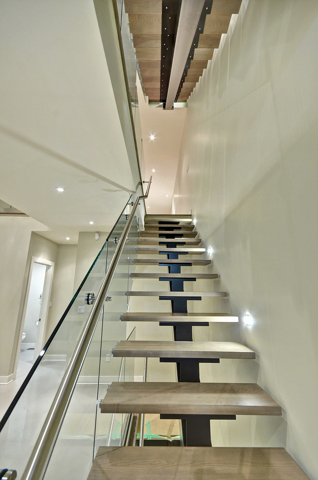 Example of a large trendy wooden straight open and glass railing staircase design in Ottawa