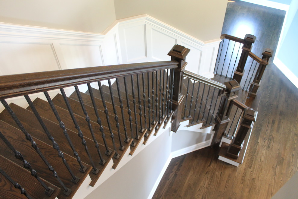 Staircase - mid-sized traditional wooden curved staircase idea in Chicago with painted risers