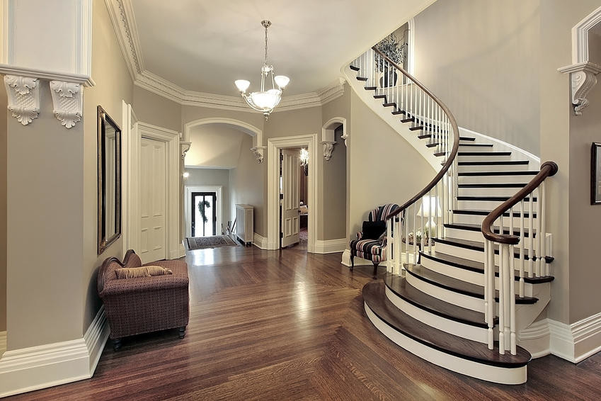 Staircase - mid-sized traditional wooden curved staircase idea in Dallas with painted risers