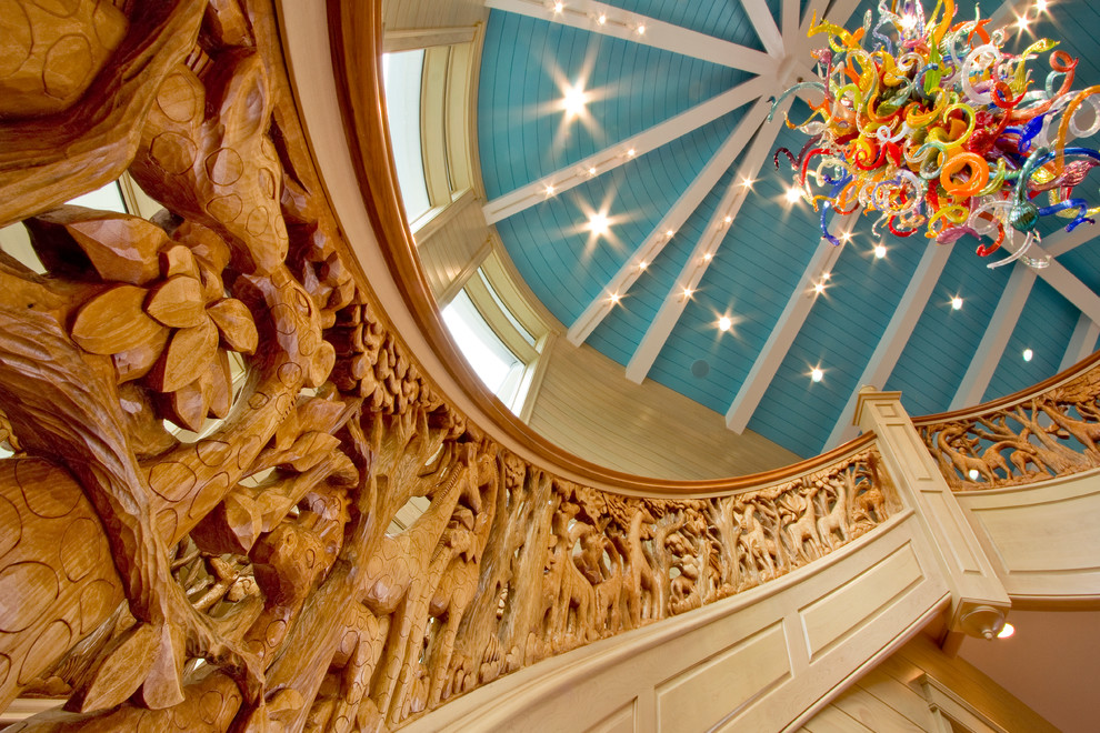 Staircase - large eclectic curved wood railing staircase idea in Detroit