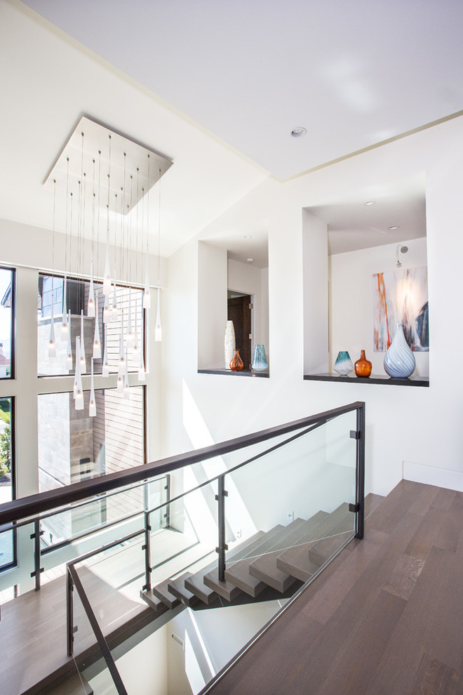Modelo de escalera en U contemporánea de tamaño medio sin contrahuella con escalones de madera y barandilla de varios materiales